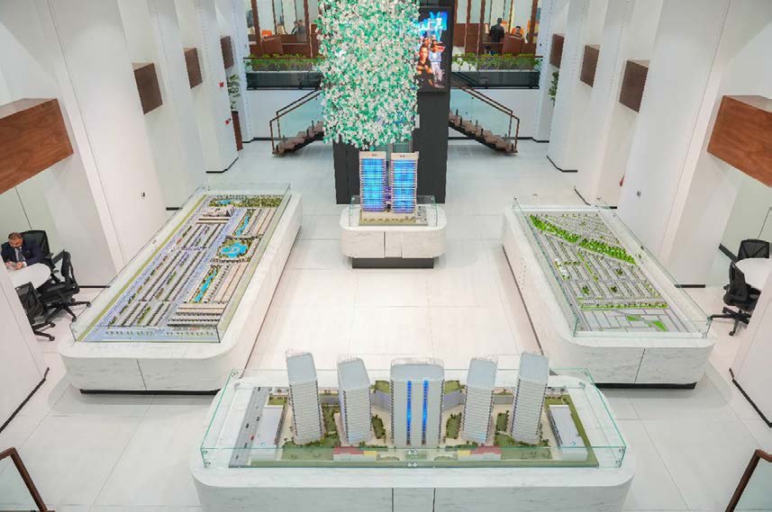 Architectural models and staircase at Al-Omnyat Sales Center — MCC project management
