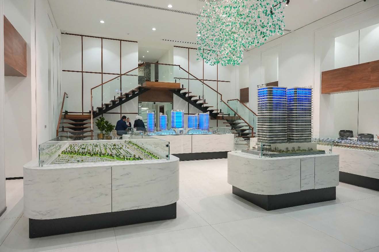 Al-Omnyat Sales Center — architectural models and staircase, representing MCC project management coordination