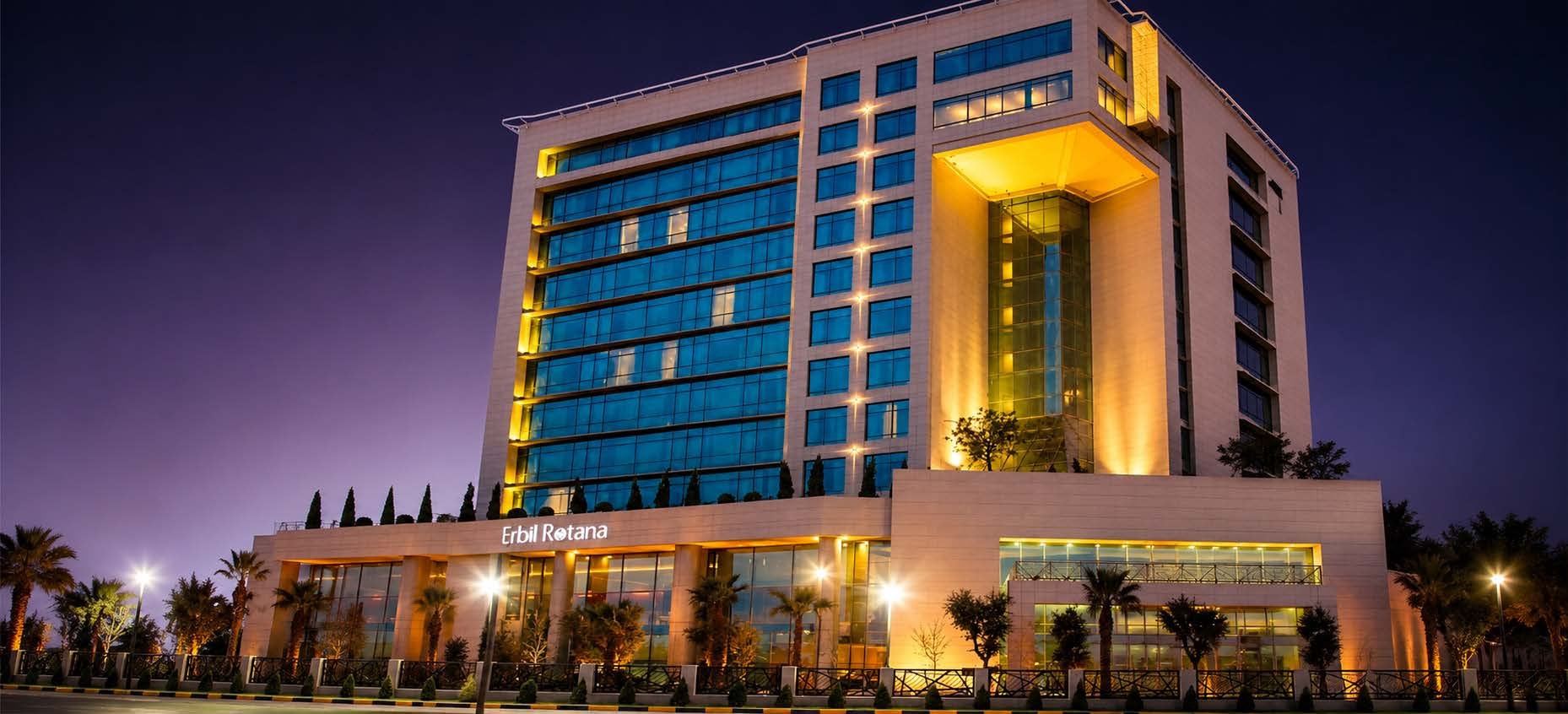 Rotana Hotel tower illuminated at night, Erbil